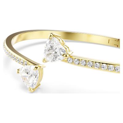 Brac.jonc Swarovski Mesmera doré à l'or 18 carat